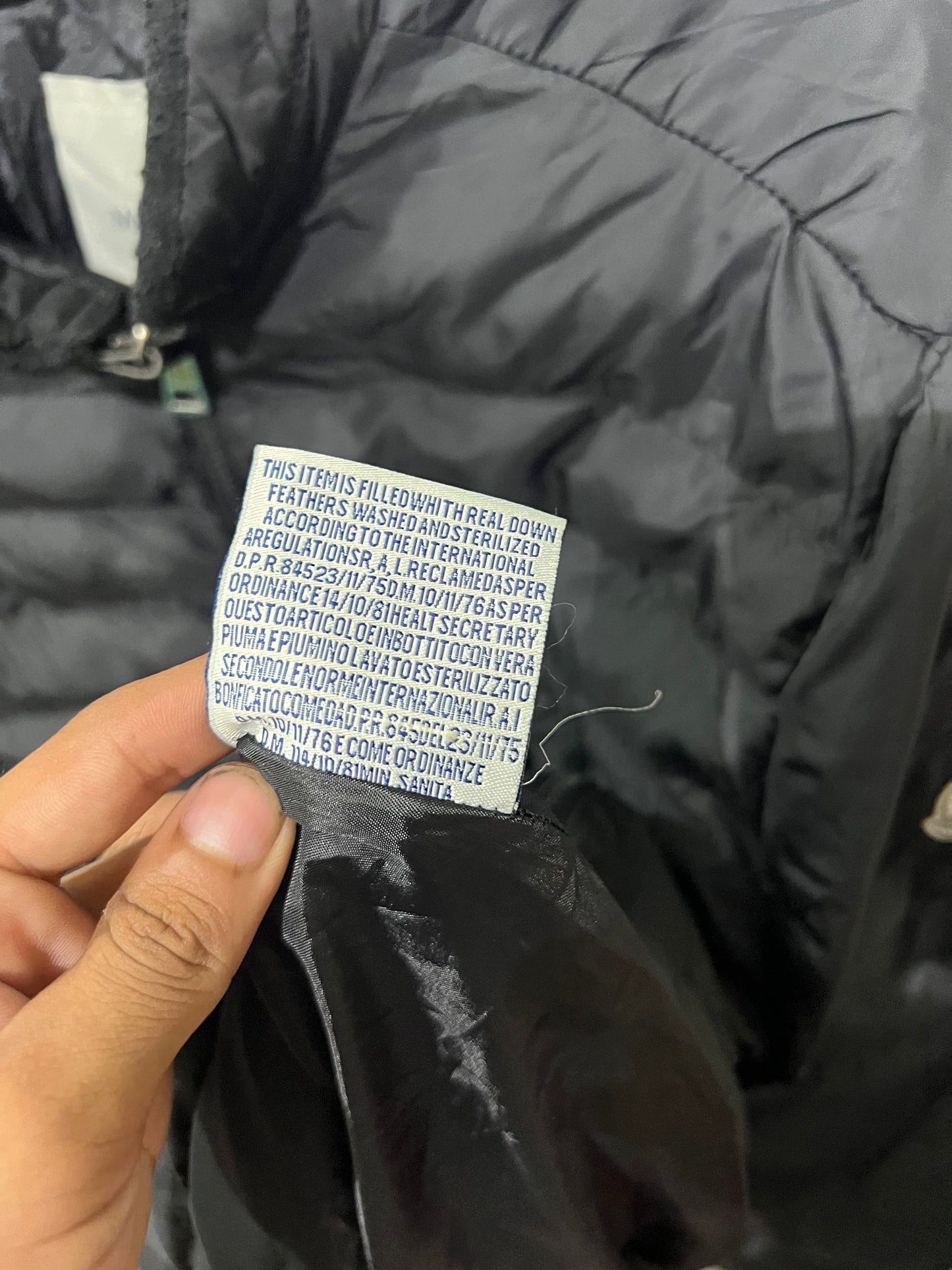 Moncler Hanriot puffer jacket featuring a black quilted