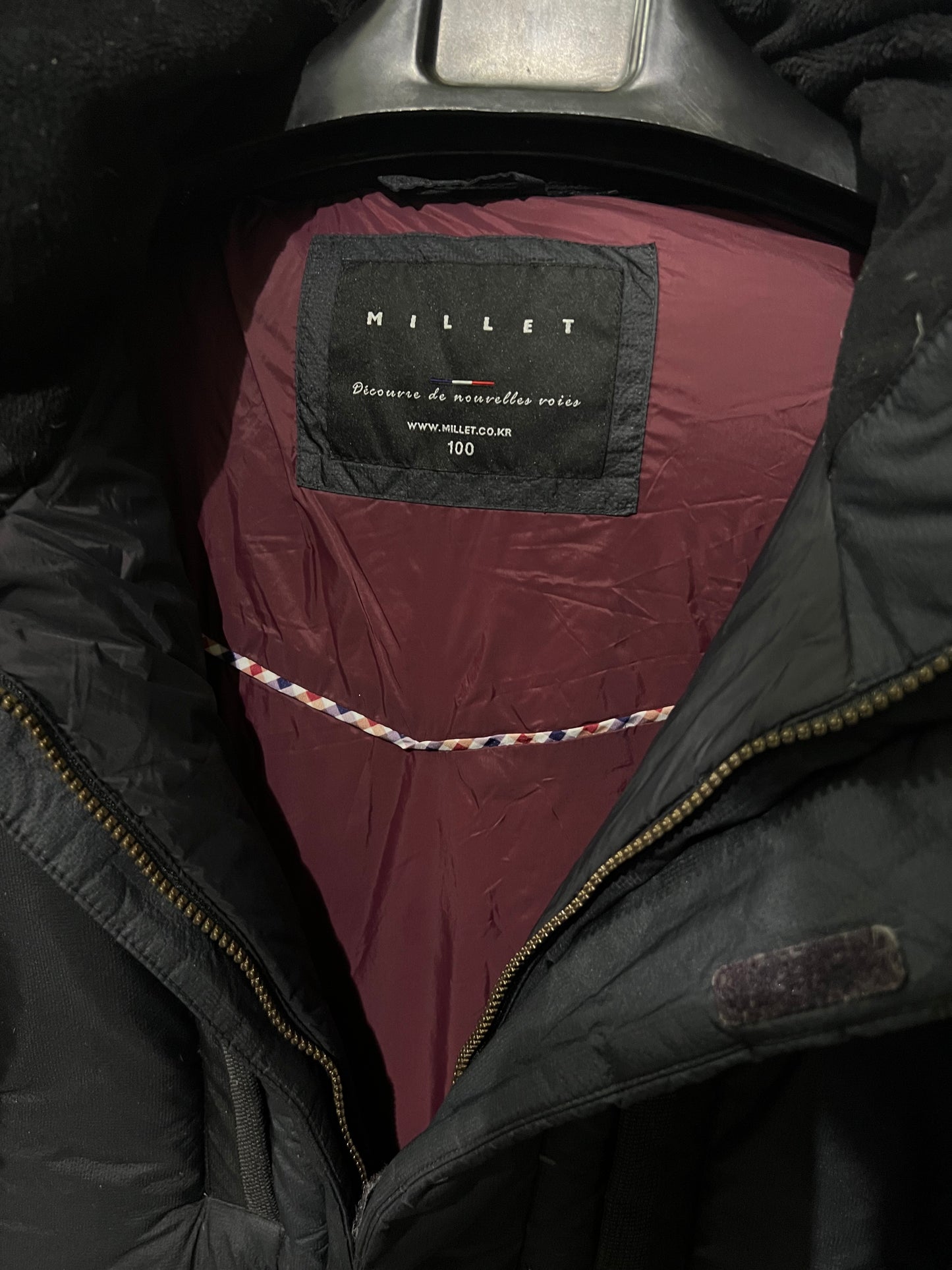Millet down parka features an embroidered jacket