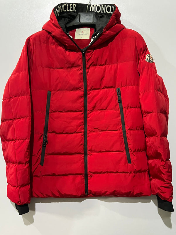 Moncler puffer jacket features bold branding along the inner zipper placket