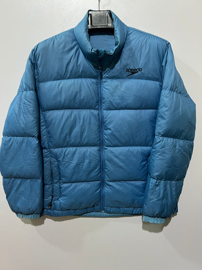 Speedo puffer jacket features a high collar and quilted construction for warmth.