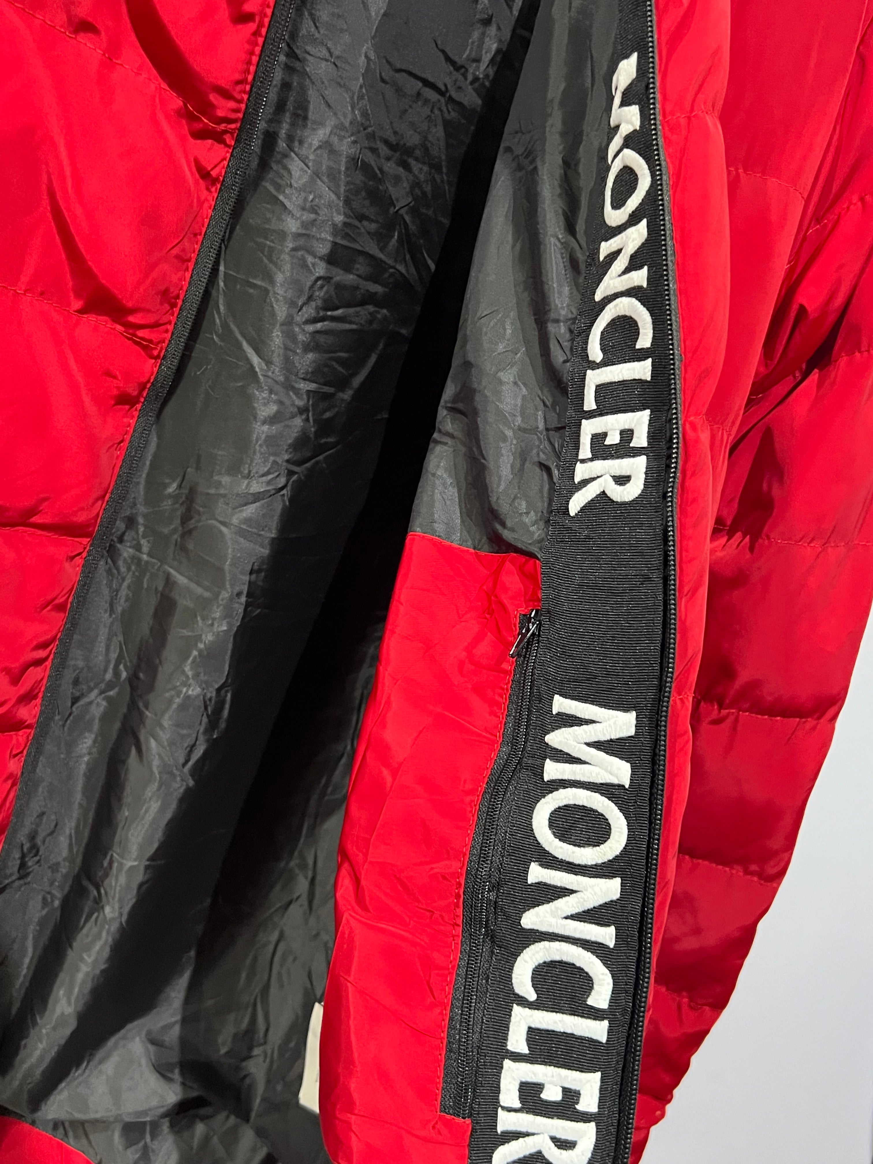 Moncler puffer jacket features bold branding along the inner zipper placket