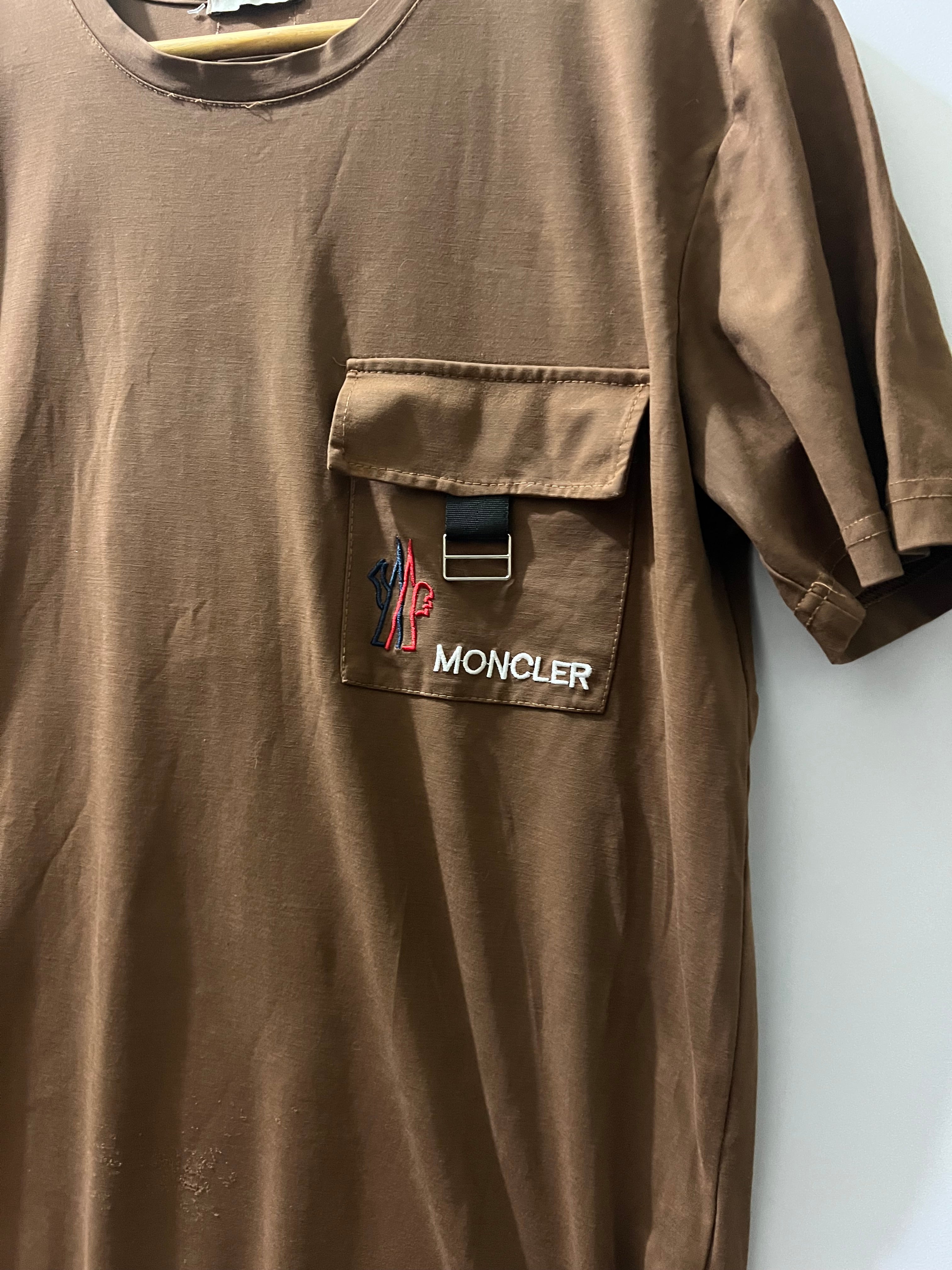Moncler cotton crewneck T-shirt from Moncler features a prominent utility patch pocket