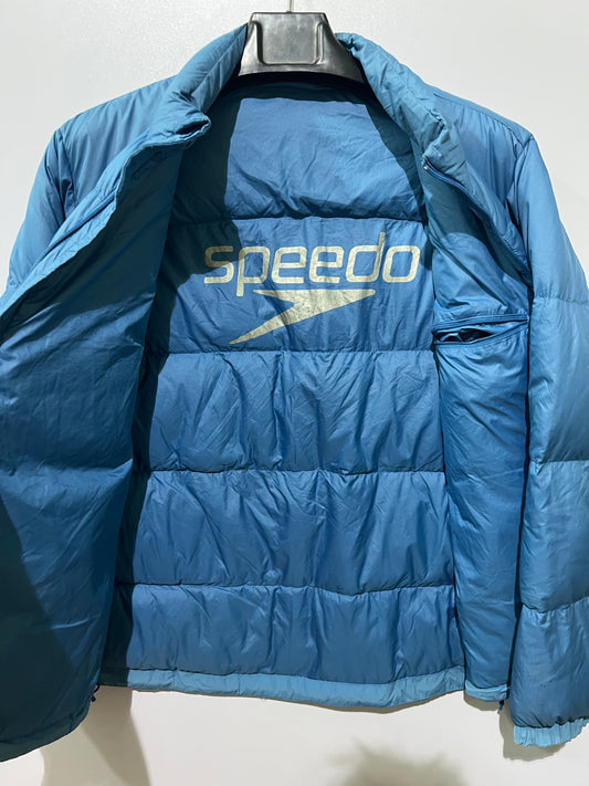 Speedo puffer jacket features a high collar and quilted construction for warmth.