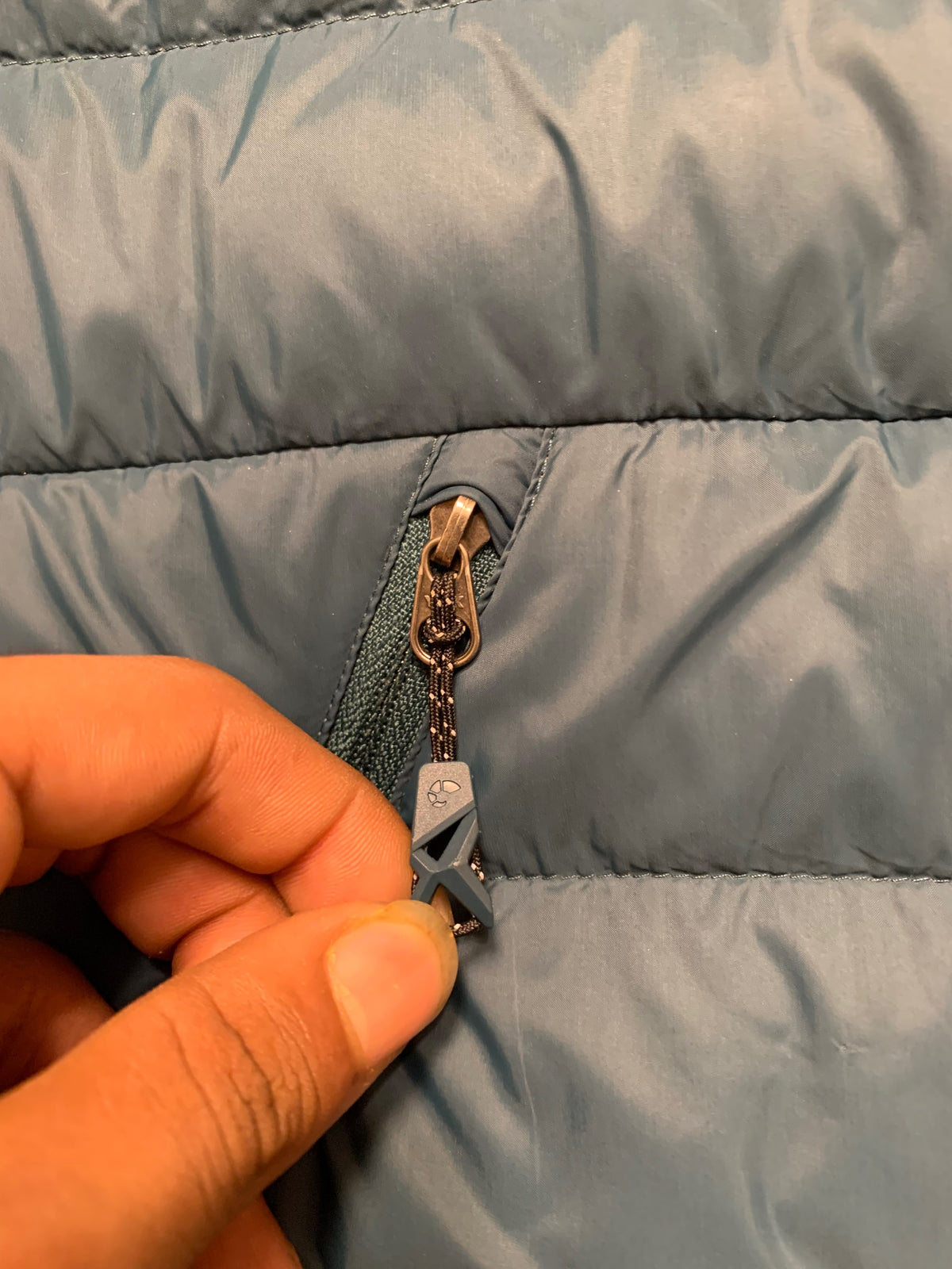 Moncler logo patch on the left sleeve, resembling a Moncler down jacket. [1]