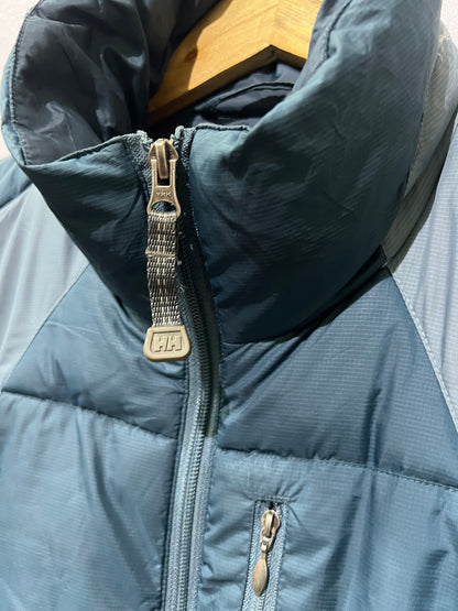 vintage teal Helly Hansen puffer jacket features a prominently embroidered logo