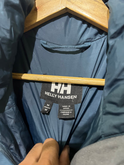 vintage teal Helly Hansen puffer jacket features a prominently embroidered logo