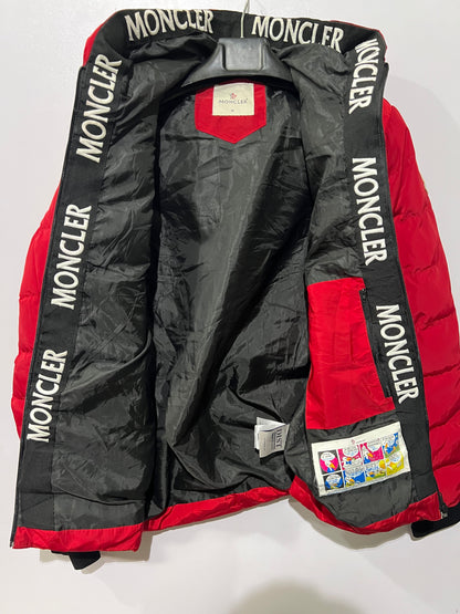 Moncler puffer jacket features bold branding along the inner zipper placket