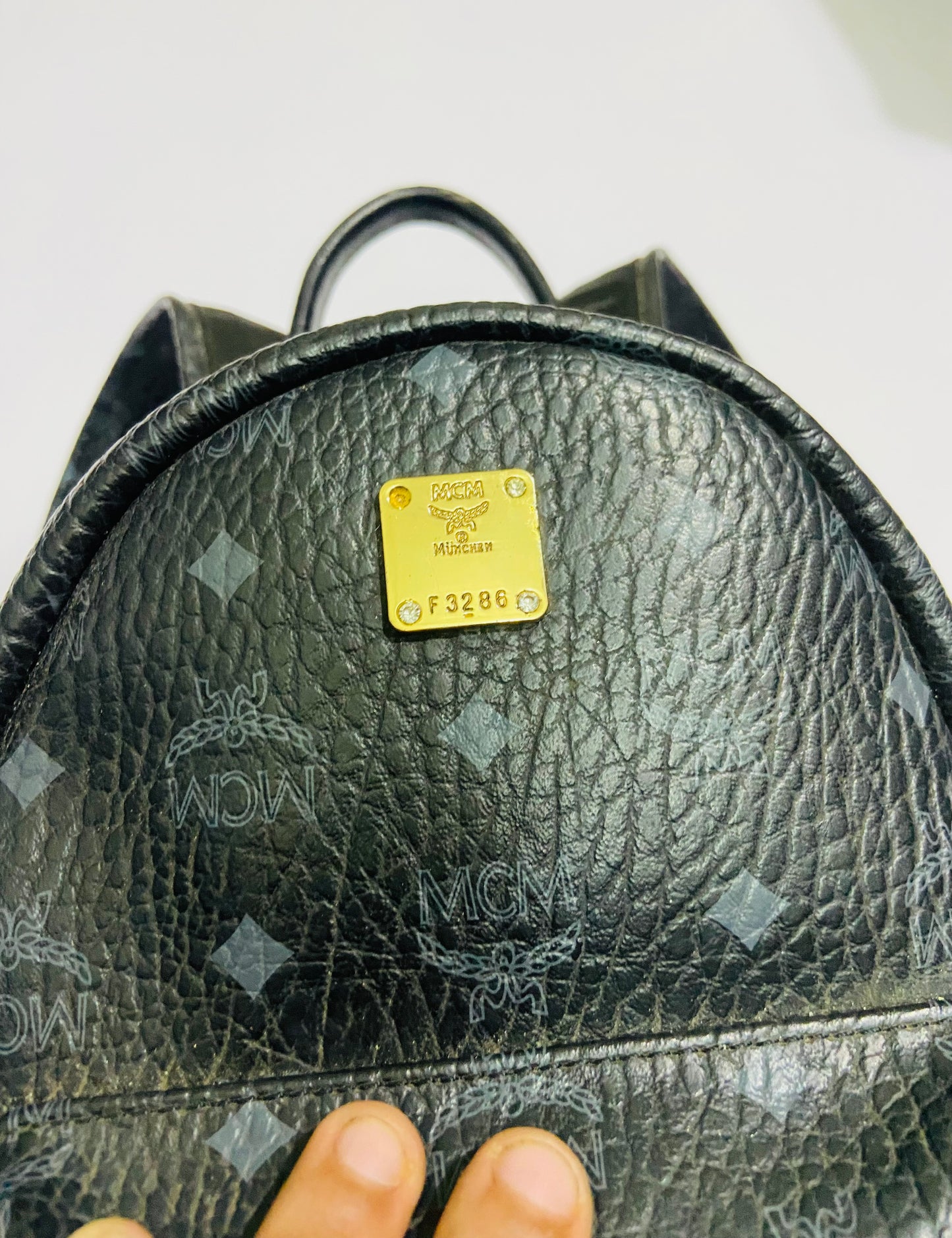 MCM Stark Backpack bag in black Visetos canvas.