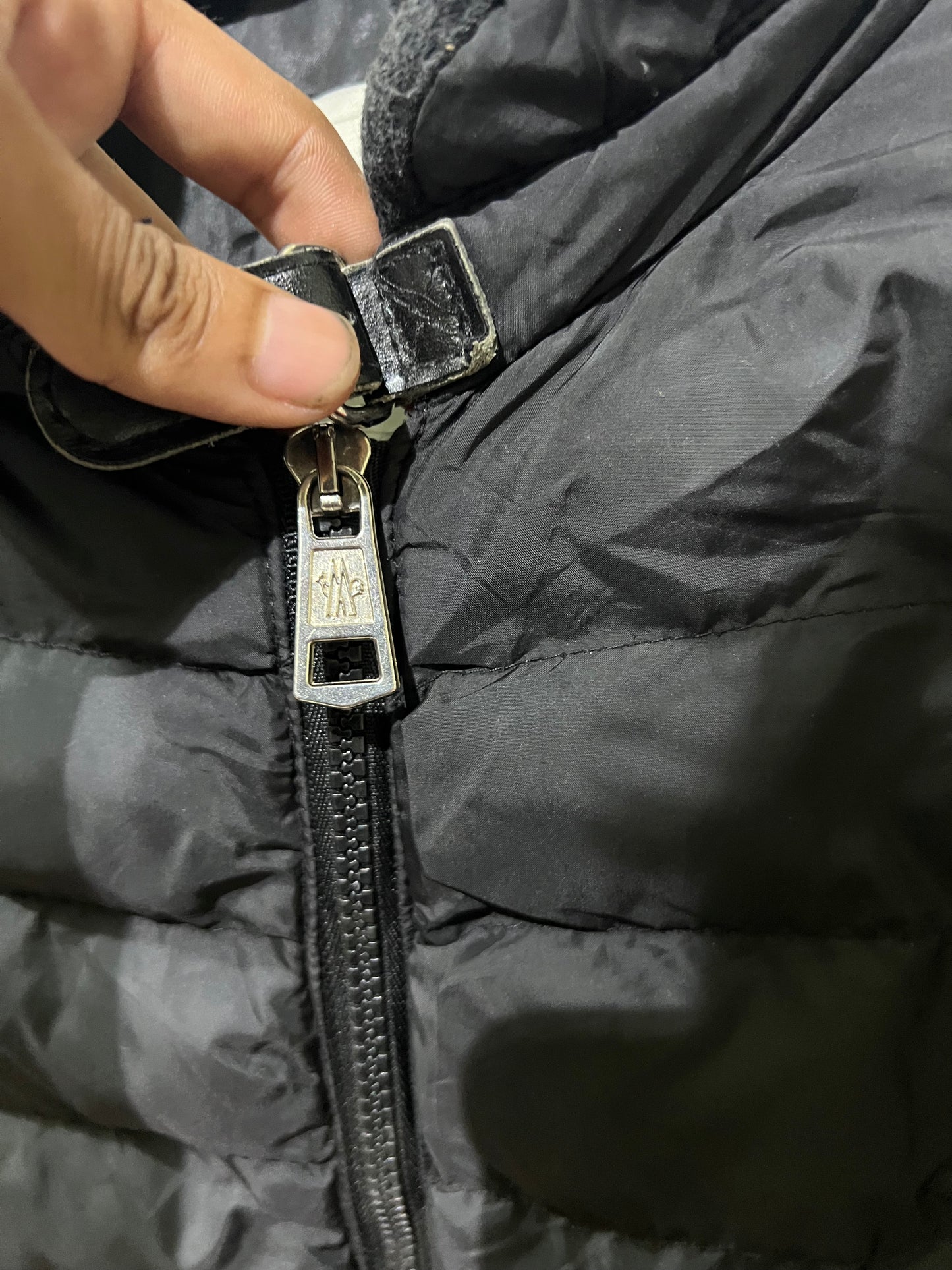 Moncler Hanriot puffer jacket featuring a black quilted