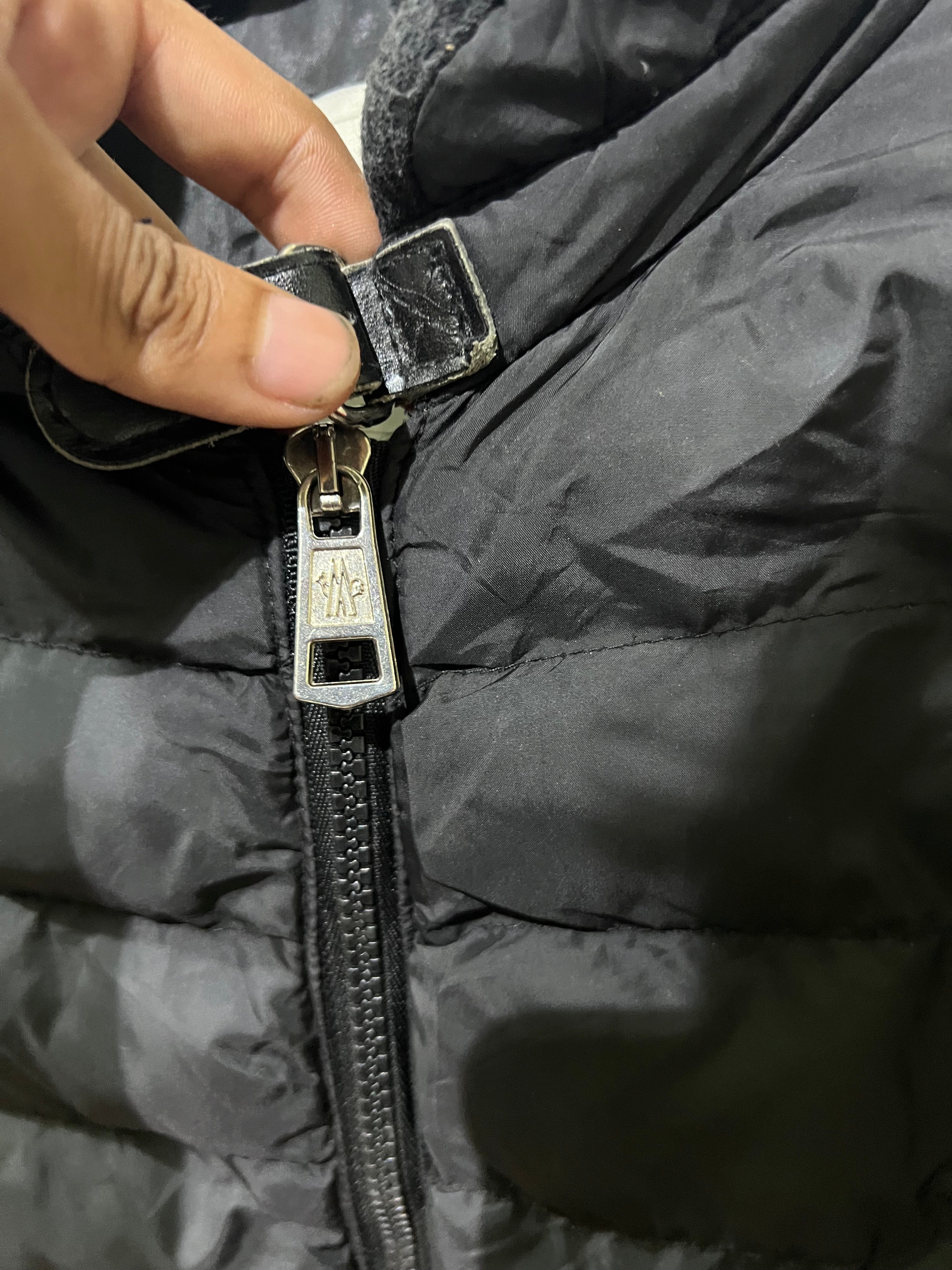 Moncler Hanriot puffer jacket featuring a black quilted