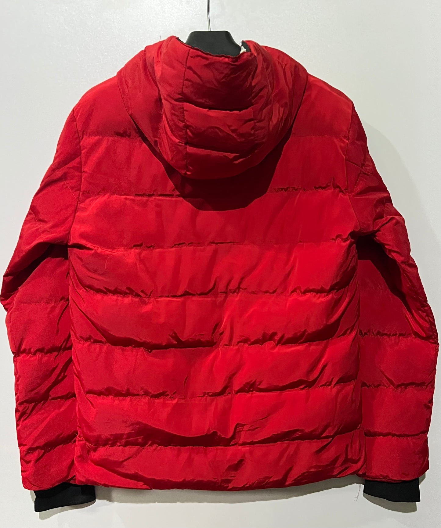 Moncler puffer jacket features bold branding along the inner zipper placket