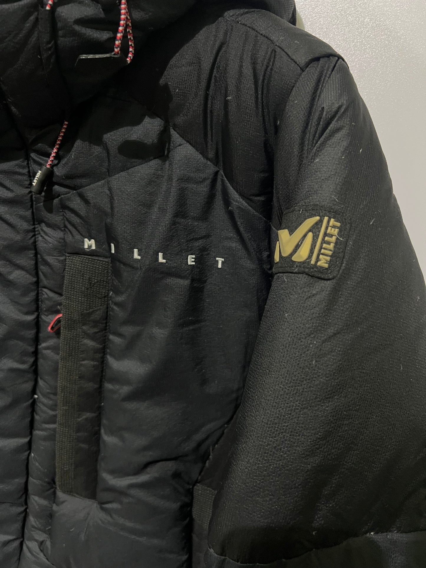 Millet down parka features an embroidered jacket
