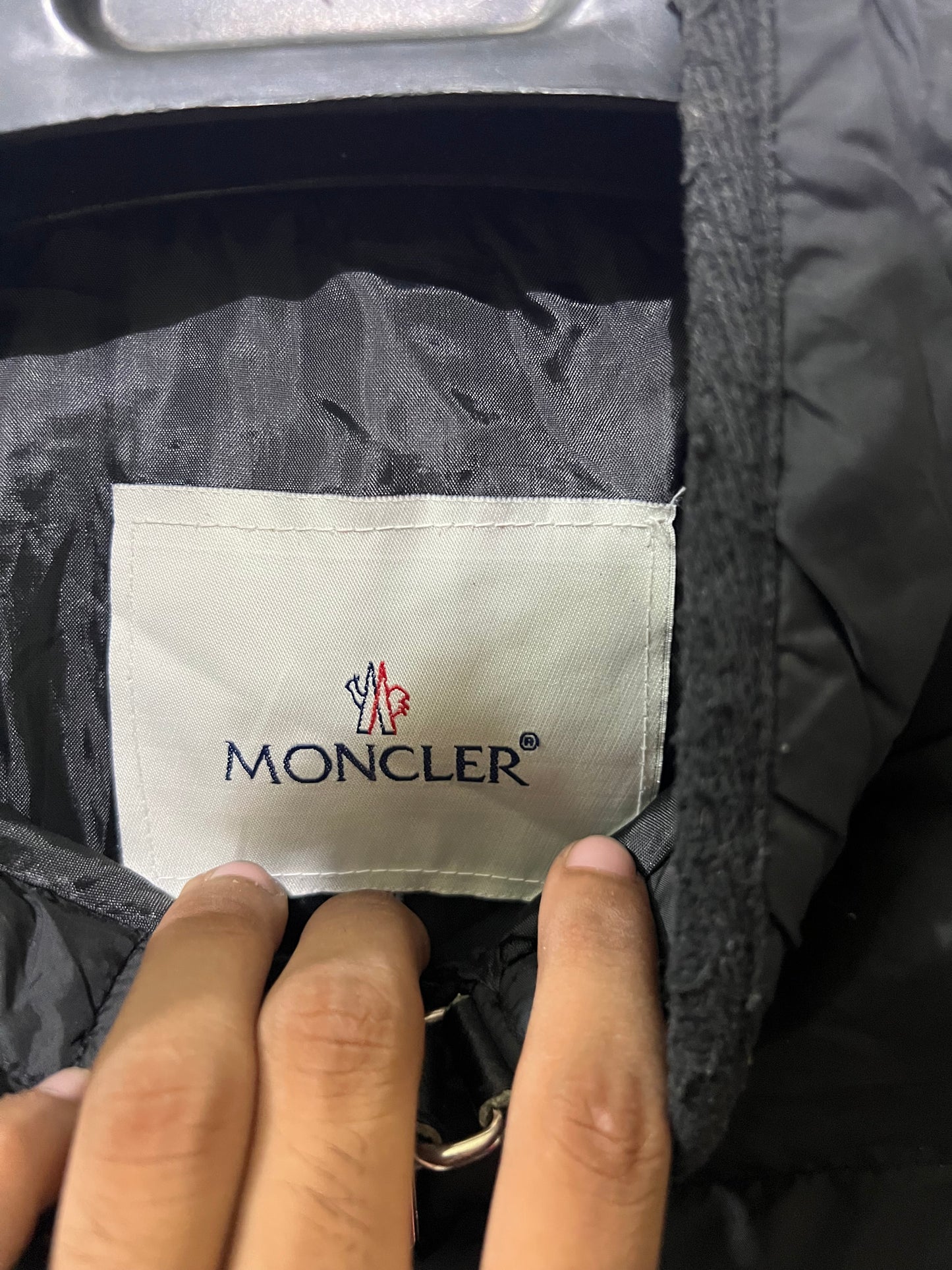 Moncler Hanriot puffer jacket featuring a black quilted