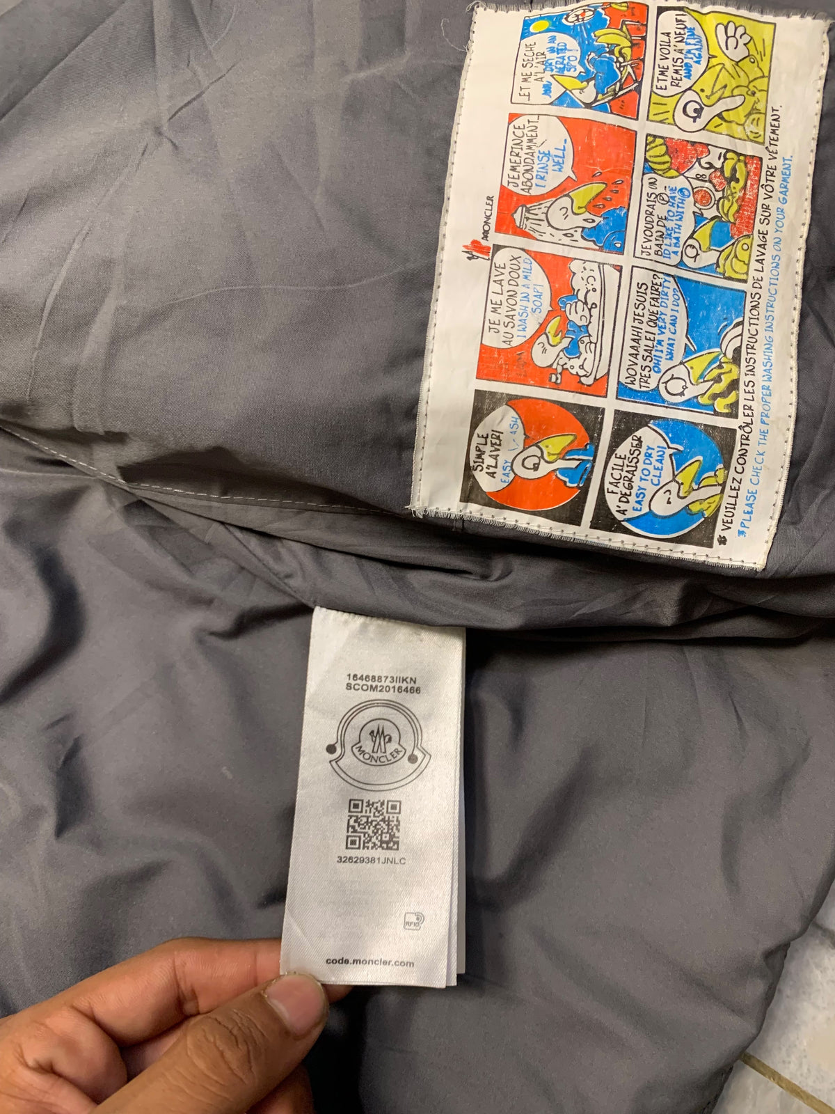 Moncler logo patch on the left sleeve, resembling a Moncler down jacket. [1]