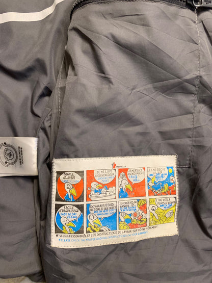 Moncler logo patch on the left sleeve, resembling a Moncler down jacket. [1]